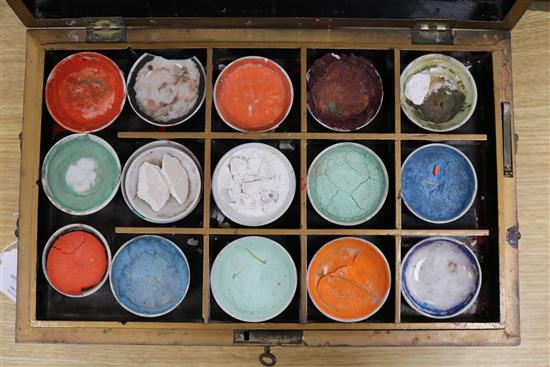 A Chinese export lacquer artists box, containing ceramic dishes